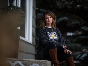 Marie Agioritis pictured wearing a sweatshirt sold by Prairie Harm Reduction that depicts her son Kelly, who died of an overdose six years ago.