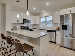 The Bradwell Townhomes, constructed by North Ridge Development Corporation on McOrmand Drive in Brighton, offer three different kitchen configurations. The show suite features an attractive peninsula-style kitchen, with painted Shaker-style cabinets, quartz countertops and upgraded stainless steel apppliances.