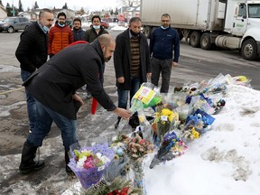 Calgary police and first responders from all over the province held a parade around Falconridge as citizens continued to lay flowers at the location where Sgt. Andrew Harnett was killed Thursday night after he was struck by a fleeing vehicle at a traffic stop in Calgary on Monday, Jan. 4, 2021.