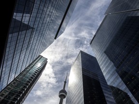 The CN Tower is surrounded by business buildings in Toronto during the COVID-19 pandemic.