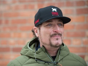 Kim Coates, an actor in the film Donkeyhead, stands on the film's set near Rose Street and 14th Avenue in Regina on Jan. 22, 2021.