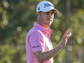 January 7, 2021; Maui, Hawaii, USA; Justin Thomas acknowledges the crowd after making his putt on the 18th hole during the first round of the Sentry Tournament of Champions golf tournament at Kapalua Resort - The Plantation Course. Mandatory Credit: Kyle Terada-USA TODAY Sports