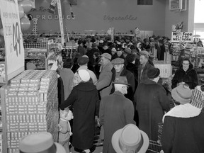 Crowds at the opening of the new Safeway at the Avalon Shopping Centre at Cascade Street and Broadway Avenue, including some of the estimated 1,200 to 1,500 people who were in the store at one point that morning, Feb. 25, 1960.