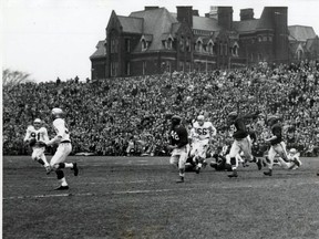 Edmonton's Jackie Parker (No. 91) throws on the run during the 1954 Grey Cup in Toronto.