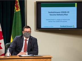 Saskatchewan Health Minister Paul Merriman speaks to media in the radio room during a news conference regarding COVID-19 vaccinations held at the Saskatchewan Legislative Building in Regina, Saskatchewan on Dec. 9, 2020.