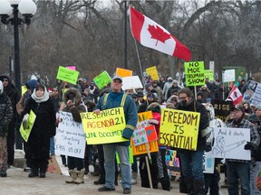 Participants listen to speakers during what was billed as the Saskatchewan Freedom Rally held at the Saskatchewan Legislative Building in Regina, Saskatchewan on Dec. 12, 2020.
