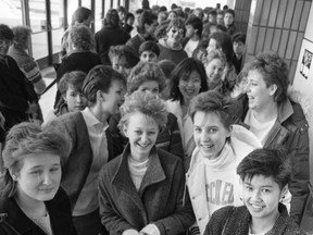A photo of people waiting in line for the ticket windows to open at Centennial Auditorium (now TCU Place), to buy tickets for the music group Mr. Mister, playing April 9, from Feb. 18, 1986. Identified are Nancy Ferguson, Margy Myers, Caroline Presger and Susanna Chan.