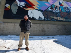 Chris Randall, a Saskatoon housing advocate, is pictured by the White Buffalo Youth Lodge.