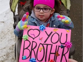 Presley Fidler with a sign supporting her brother Oakley. at a parade held for him. Photo taken in Saskatoon, SK on Feb. 21, 2021. (Provided: Lana Fidler)