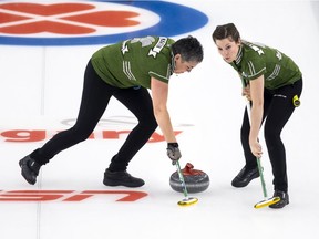 Team Saskatchewan third Nancy Martin (left) and lead Breanne Knapp sweep during Wednesday's victory at the Scotties.