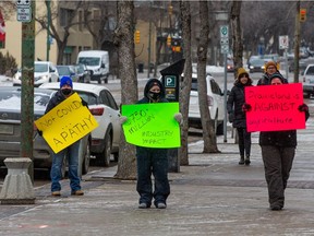 A group gathered outside of City Hall Friday to rally against the decision to cancel the 2021 thoroughbred season at Marquis Downs at Prairieland Park.