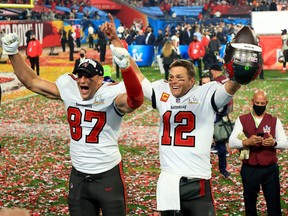 Rob Gronkowski, left, and Tom Brady of the Tampa Bay Buccaneers celebrate after defeating the Kansas City Chiefs in Super Bowl LV at Raymond James Stadium on Feb. 7, 2021 in Tampa, Fla.