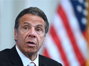 (FILES) In this file photo Governor of New York Andrew Cuomo speaks during a press conference at the New York Stock Exchange (NYSE) on May 26, 2020 at Wall Street in New York City. - Prominent Democratic politicians called on February 28, 2021 for an independent investigation into sexual harassment allegations against New York governor Andrew Cuomo after a second former aide accused him of misconduct. The latest allegations were made public on Saturday after 25-year-old former health advisor Charlotte Bennett told The New York Times the governor sexually harassed her in 2020.