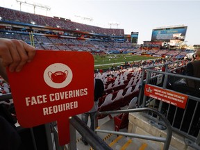 NFL Football - Super Bowl LV - Tampa Bay Buccaneers v Kansas City Chiefs - Raymond James Stadium, Tampa, Florida, U.S. - February 7, 2021 General view of a notice displaying an instruction to wear face coverings in the stands due to the coronavirus disease (COVID-19) inside the stadium before the game REUTERS/Brian Snyder