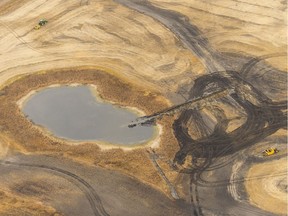 A trench cuts into a wetland in order to drain it, and prepare it for cultivation. The dark areas used to be wetlands. MICHAEL BELL / Regina Leader-Post.