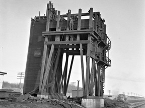 This March 4, 1957 image shows the demolition of the coal docks at the CNR's South Saskatchewan yards (across from the present-day Western Development Museum site), following the railway's move away from coal-fired steam engines.