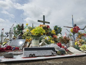 Hockey sticks, messages and other items at a memorial for the Humboldt Broncos bus crash at the intersection of highways 35 and 335 inside the the Rural Municipality of Connaught, SK on Wednesday, August 1, 2018.