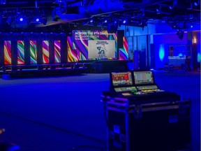 Workers watch prepared Juno Awards Gala projections on Thursday, March 12, 2020 at Prairieland Park in Saskatoon, which was supposed to host the Juno Awards Gala. The Junos were cancelled due to the COVID-19 pandemic.