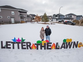 Natasha Pytlak, left, and Zach Smith run Letter the Lawn, a lawn display service that sets up custom messages to help celebrate special occasions. Photo taken in Saskatoon, SK on Friday, February 26, 2021.