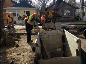 A crew works to replace a lead water connector line in this undated handout photo supplied by the City of Saskatoon.
