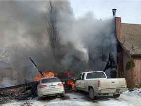 The Saskatoon Fire Department responded to a garage fire in Corman Park on Mon. March 1, 2021 at 1:11 p.m. Two people in the attached home were transported to hospital with minor injuries. A dog died and a cat was resuscitated with the use of a pet mask. Photo provided by the Saskatoon Fire Department.