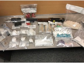 Following a traffic stop near Maidstone and a search of a home in Waldheim, Saskatchewan RCMP members seized methamphetamine, cocaine, fentanyl, Pprescription pills, a modified shotgun, two conducted energy devices and over $30,000 cash. Photo courtesy RCMP.