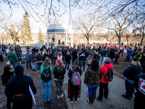 People gathered at Vimy Memorial to protest mandatory mask laws and the government's handling of the COVID-19 pandemic. Photo taken in Saskatoon, SK on Saturday, March 20, 2021.