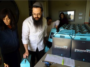 Rabbi Raphael Kats and his family hand out Passover food at the Chabad Jewish Centre, as most major grocery stores in Saskatoon did not stock appropriate food for the important Jewish holiday. Photo taken in Saskatoon on Friday March 26, 2021.