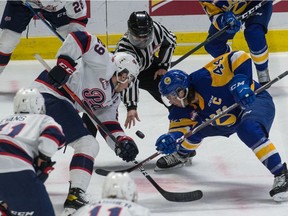 The Regina Pats' Logan Nijhoff (29) faces off with the Saskatoon Blades' Chase Wouters (44) during a WHL hockey game held at the Brandt Centre in Regina Friday.