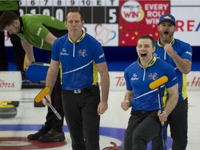 Team Alberta third Darren Moulding,(R-L), second Brad Thiessen and lead Karrick Martin celebrate after defeating Saskatchewan in the 2021 Brier semifinal. Team Alberta takes on Calgary's Kevin Koe (Wild Card 2) in the final. (Curling Canada/ Michael Burns Photo)