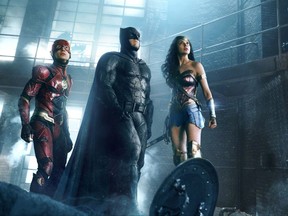 This image released by Warner Bros. Pictures shows Ezra Miller, from left, Ben Affleck and Gal Gadot in a scene from "Justice League."