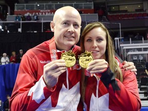 Kevin Koe and Rachel Homan celebrate their wins at the 2017 Roar of the Rings Olympic Curling Trials in Ottawa on Sunday, December 10, 2017.