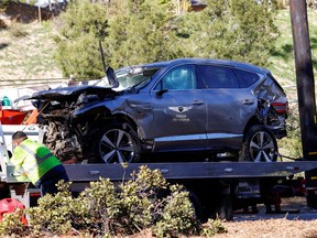 The damaged car of Tiger Woods is towed away after he was involved in a car crash, near Los Angeles, California, U.S., February 23, 2021.