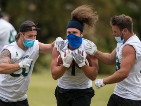 The Huskies football team stages a workout last fall on campus.