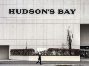 A pedestrian walks by a Hudson's Bay location in Toronto.