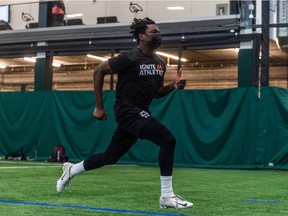 Huskies' defensive back Nelson Lokombo runs a 40-yard dash for CFL scouts Tuesday at the Gordie Howe Sports Complex.