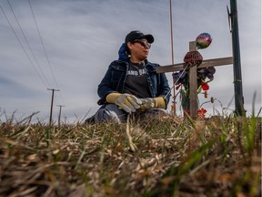 Agatha Eaglechief sits at a memorial for her son, Austin Eaglechief. Austin was killed in a police pursuit at Circle Drive and Airport Road on June 19, 2017. Photo taken in Saskatoon on Thursday, April 8, 2021.