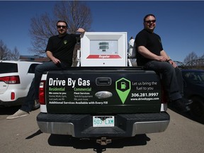 Drive By Gas co-owners Mat Lukash and Andrew Wionzek sit atop one of their fuel trucks which they use to deliver fuel to your vehicle and provide other basic car services. Photo taken in Saskatoon on Thursday April 15, 2021.