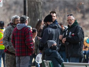 A man identified as Brent Wintringham, a janitor at Hugh Cairns V.C. School in Saskatoon, is seen at right with glasses among those gathered in Kiwanis Park for a "children's freedom rally." The rally comes a week after attendees of a rally in Prince Albert were told to self-isolate after an attendee tested positive for COVID-19.  The same man was seen at the Prince Albert rally. Photo taken in Saskatoon, SK on Saturday, April 24, 2021.
