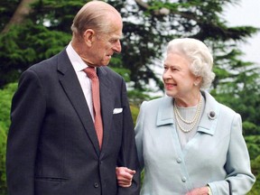 Queen Elizabeth and her husband, the Duke of Edinburgh, walk at Broadlands, Hampshire, in a photo released on November 18, 2007 to mark their diamond wedding anniversary.