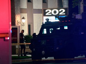 A police officer stands outside a building were multiple people were killed in a shooting in Orange, California on March 31, 2021.