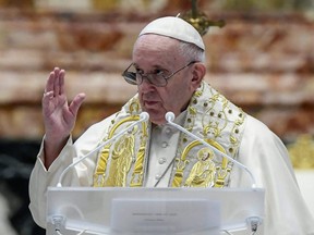 Pope Francis delivers his Urbi et Orbi blessing, after celebrating Easter Mass at St. Peter's Basilica at the Vatican on Sunday, April 4, 2021.