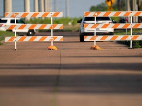 Barricades block the road leading up to the entrance of Kent Moore Cabinets in Bryan, Texas after a mass shooting at the facility on on on on April 8, 2021.
