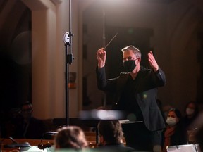 Saskatoon Symphony Orchestra conductor and artistic director Eric Paetkau leads the orchestra during their Oktoberfest-themed concert during the COVID-19 pandemic.