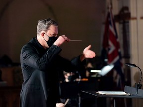 Saskatoon Symphony Orchestra conductor and artistic director Eric Paetkau leads the orchestra during their Carnival of Venice concert during the COVID-19 pandemic.