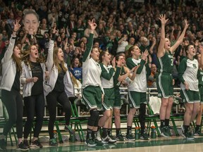 The University of Saskatchewan Huskies' bench cheers during the 2020 Canada West women's basketball conference final against the University of Alberta Pandas at the PAC on the U of S campus in Saskatoon on Friday, February 28, 2020.