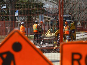 City workers work on Taylor Street near Ashley Park on May 4.