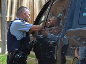 Cpl. Bernie Herman speaks to a driver at the Selective Traffic Enforcement Program (STEP) on August 22, 2019. Herman entered a not guilty plea to the charge of first-degree murder in the May 11, 2021 death of Braden Herman. According to police, the two were known to each other but were not related. (Jayda Noyes / Prince Albert Daily Herald file photo)