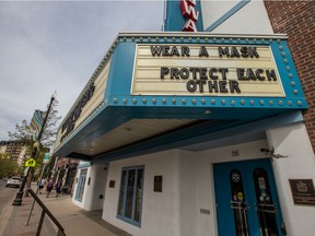 The marquee in front of the Broadway Theatre reads "Wear a mask, protect each other." Photo taken in Saskatoon on May 17, 2021.