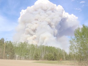Helicopters, ground crews, tankers and heavy equipment operators were called in on May 17, 2021 to battle a large fire burning northeast of Prince Albert. An emergency alert was sent out for those in the areas, and several evacuations were ordered. (Michael Oleksyn / Prince Albert Daily Herald)